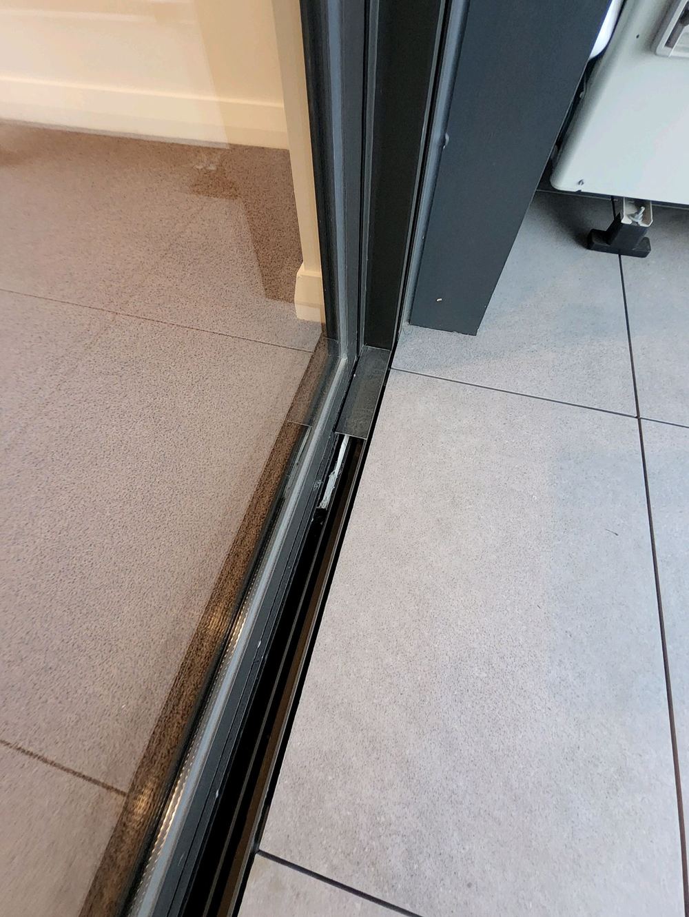 Sliding door tracks full of building dust that will wear the rollers, Castle Hill